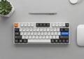 A mechanical keyboard with white, black, and customized keycaps, including an orange Royalty Free Stock Photo