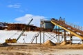 Mechanical machine, conveyor belt for transporting and crushing stone with sand. Royalty Free Stock Photo