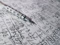 Mechanical Pencil on Hand-Written Math Calculation Paper Sheet Background