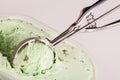 Mechanical scoop grabbing a ball of mint choc chip ice cream Royalty Free Stock Photo