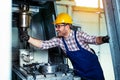 Mechanical technician worker of cnc milling cutting machine center at tool workshop manufacturing Royalty Free Stock Photo