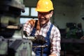 Mechanical technician working on lathe machine in car workshop. Royalty Free Stock Photo