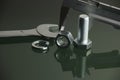 Mechanical tools and fasteners on reflective surface Royalty Free Stock Photo