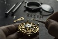 Mechanical watch repair. Watchmaker is repairing the mechanical watches
