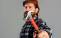 Mechanical worker, repairman or carpenter with hammer. Male builder in hard hat. Repairment.