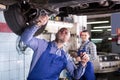 Mechanics fixing car Royalty Free Stock Photo