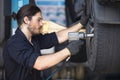 Mechanics Fixing Car Tires At Garage Royalty Free Stock Photo
