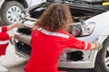 Mechanics team in uniform are working in auto service, Technician checking modern car at garage, Car repair and maintenance Royalty Free Stock Photo