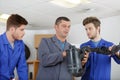 Mechanics training class with teacher and students Royalty Free Stock Photo