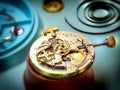 Antique golden pocket watch on the clockmaker work table Royalty Free Stock Photo