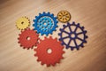 Mechanism, brainstorming and connection with cog gear on table for teamwork, solidarity and development. Collaboration