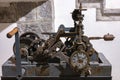 mechanism of a very old manually wound tower clock by crank in the church of Llivia or Livia