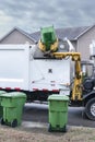 Mechanized Garbage Truck Dumping Trash From Residential Barrel Royalty Free Stock Photo