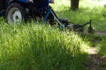 Mechanized mowing of grass on a tractor Royalty Free Stock Photo