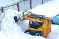 Mechanized snow cleaning compact road equipment.