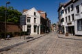 Mechelen, Belgium. August 2019. On a beautiful sunny summer day, a street in the historic center. The street with the stone blocks