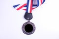Medal with blue and red ribbon isolated on white Royalty Free Stock Photo