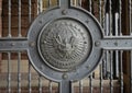 Medallion on the iron gate leading into exclusive commercial real estate, at the side of the renovated old Parkland hospital.