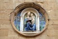 Medallion with the Virgin Mary and Child by Luca della Robbia on the facade of Orsanmichele Church in Florence Royalty Free Stock Photo