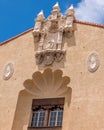 Medallions and carved details on a traditional Spanish style building.