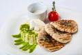 Medallions of pork with rice and sauce