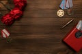 Medals and flowers on wooden table for day of glory, 9 may.