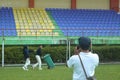 photographer taking pre-wedding moments at the stadium