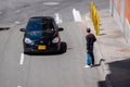 Young Venezuelan Man Stops a Car to Sell Candy on the Street