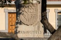 The coat of arms of Hernan Cortes in a monolith that indicates the place of his room in a square of Medellin