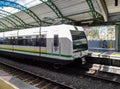 Medellin Metro train stopped at one of the stations waiting for passengers