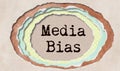 Media bias - typewritten word in ragged paper hole background - perceived bias of journalists - concept tattered illustration