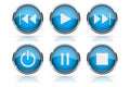 Media buttons. Blue round glass buttons with chrome frame Royalty Free Stock Photo