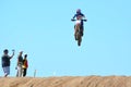 Media watching motocross rider jumping Royalty Free Stock Photo