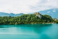 Mediaeval Bled castle on the cliff of the mountain under lake Bled with turquoise blue water in Slovenia Royalty Free Stock Photo