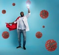 Medic acts like a superhero to fight pandemic of covid19 coronaviruses. Blue background