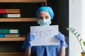 Medic in blue uniform announces the need to do medical test to identify a dangerous disease against backdrop of medical