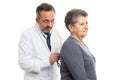 Medic checking patient by listening with stethoscope