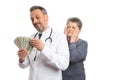 Medic counting money with patient looking