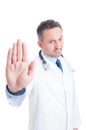 Medic or doctor showing palm as stop refuse or deny