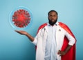 Medic like a superhero found a solution toblock the pandemic of covid19 coronavirus. Blue background