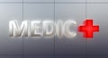Medic sign front view on steel facade with back light and red cross sign