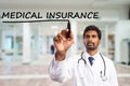 Medic underlining medical insurance text on screen