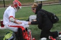 A medic is working on a injured player