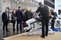 MEDICA Trade Fair, DUSSELDORF, GERMANY - NOVEMBER 2019, manual therapy, an instructor treats the back of a woman on a couch