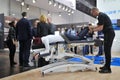 MEDICA Trade Fair, DUSSELDORF, GERMANY - NOVEMBER 2019, manual therapy, an instructor treats the back of a woman on a couch