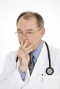 Caucasian doctor with a receding hairline wearing a white lab coat