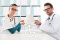 medical accident insurance concept, doctors hands with protection helmet and wheelchair icon