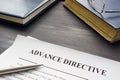 Medical Advance directive form and book with glasses. Royalty Free Stock Photo