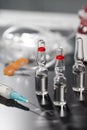 Medical ampoule and syringe. Royalty Free Stock Photo