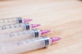 Syringe On Wood Background Royalty Free Stock Photo